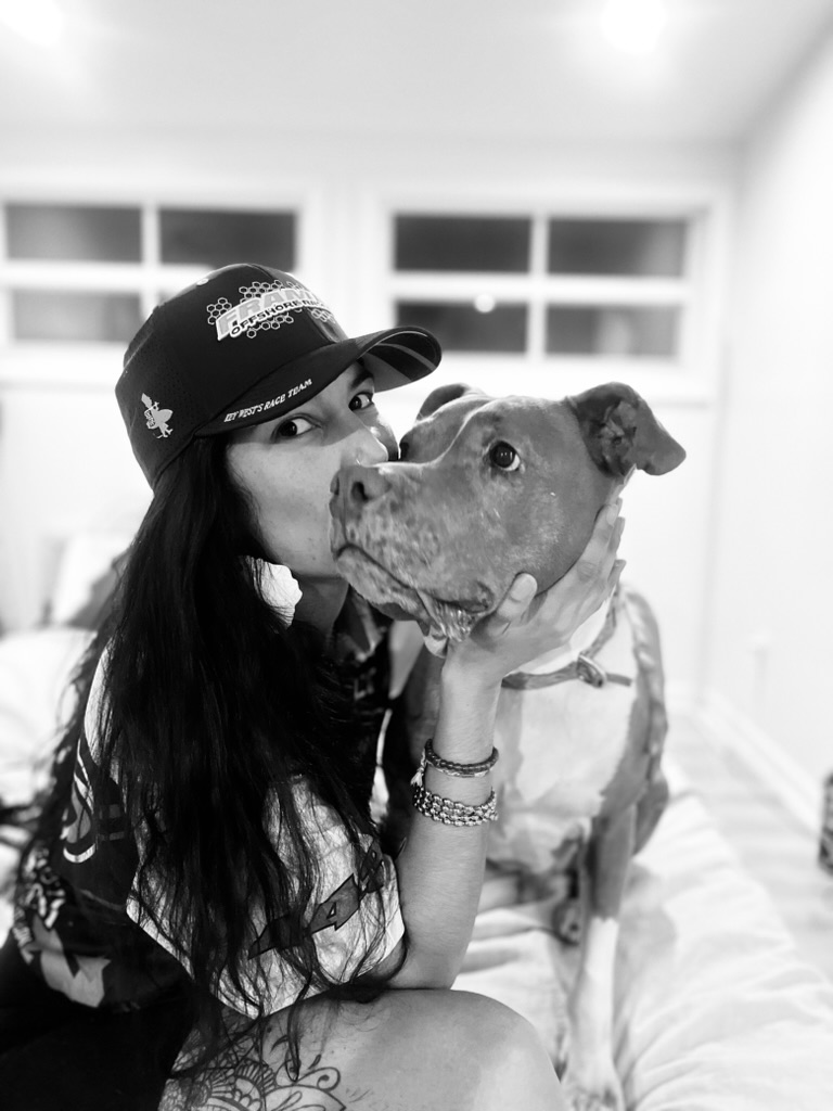 Neïla sharing an affectionate moment with a dog